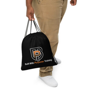 hand holding built with purpose drawstring gym bag black training bag