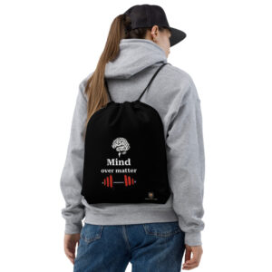 woman wearing mind over matter drawstring gym bag black motivational backpack back view